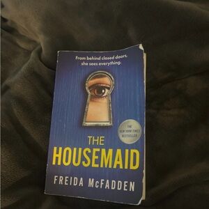 The Housemaid by Freida McFadden - Blue & Yellow Paperback